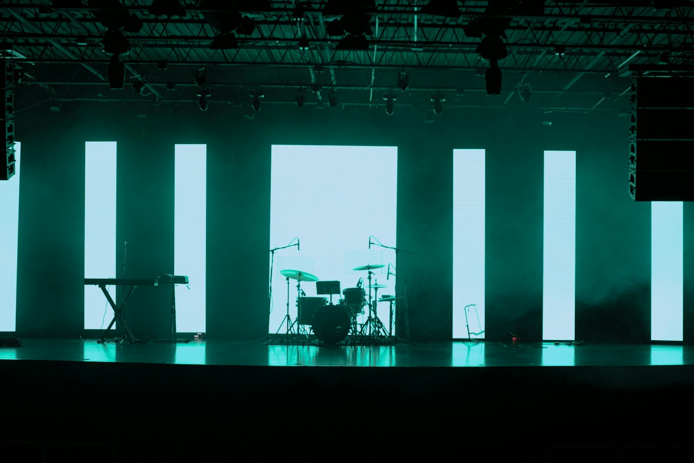 Wide view of a corporate event room, staged and lit